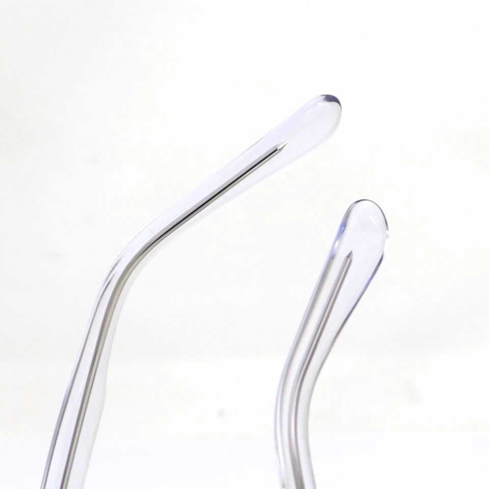 Temple arm detail of clear acetate sunglasses showing hinge polish and branding area Temple arm detail of clear acetate sunglasses showing hinge polish and branding area